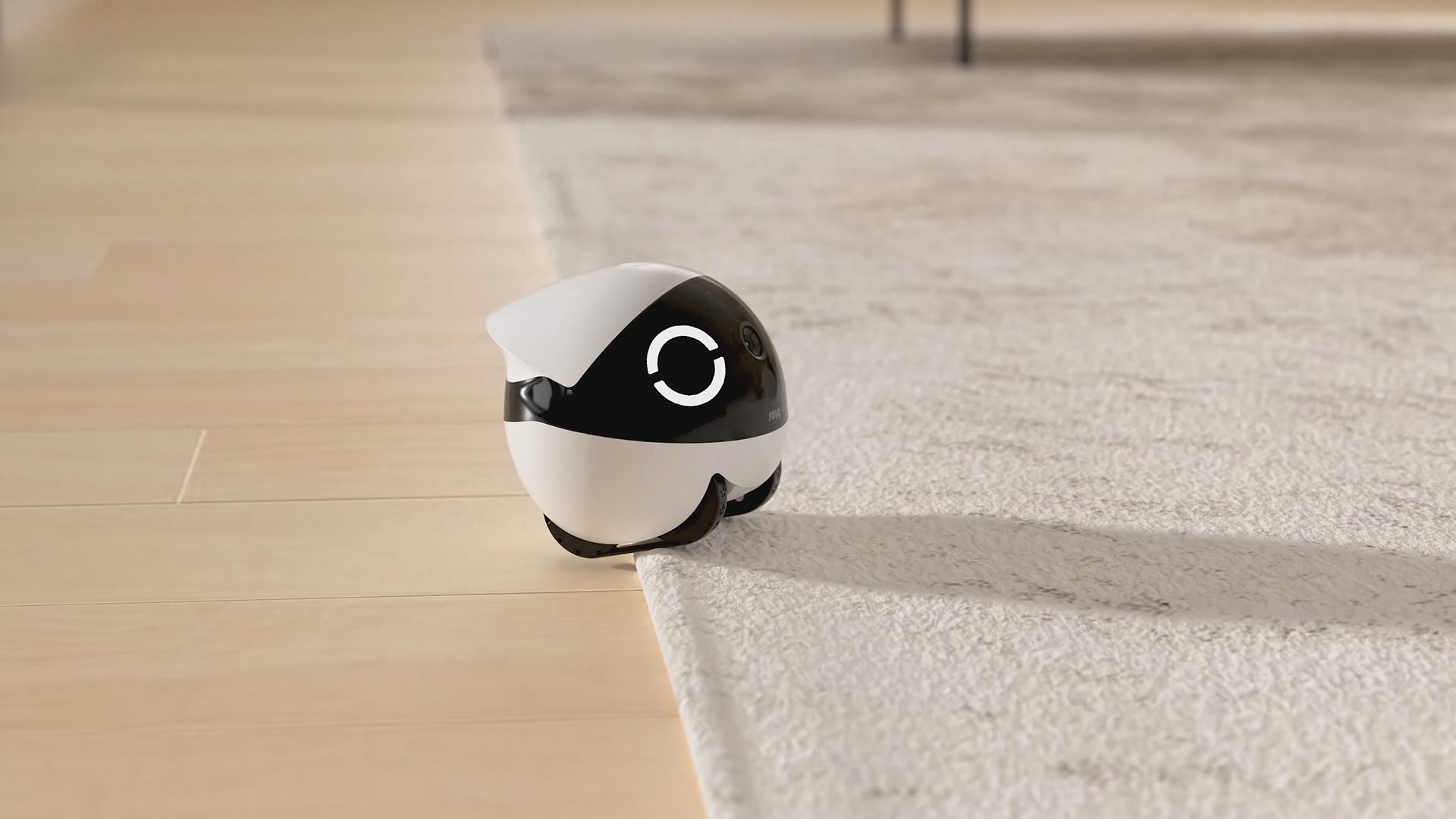 ROLA Mini climbing over a small obstacle on a home floor