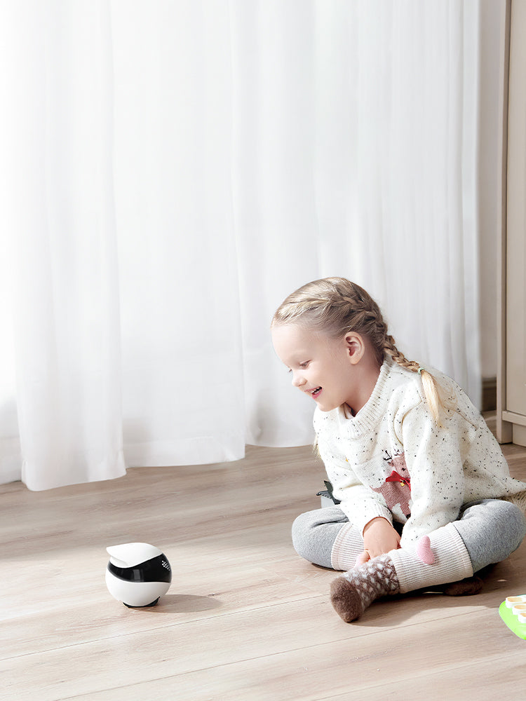 Girl at home using EBO Air 2 to have a voice call with her family.